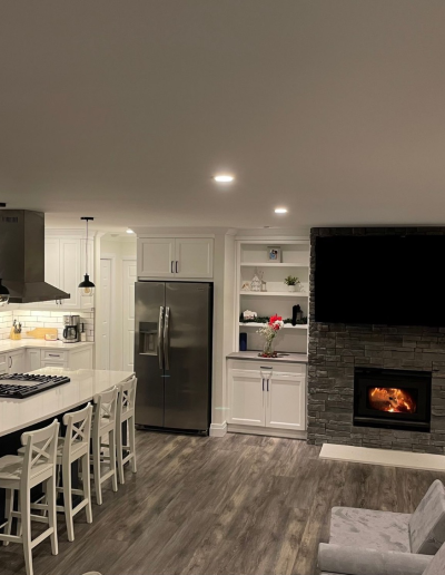 wide view of open-concept kitchen and living area after renovation